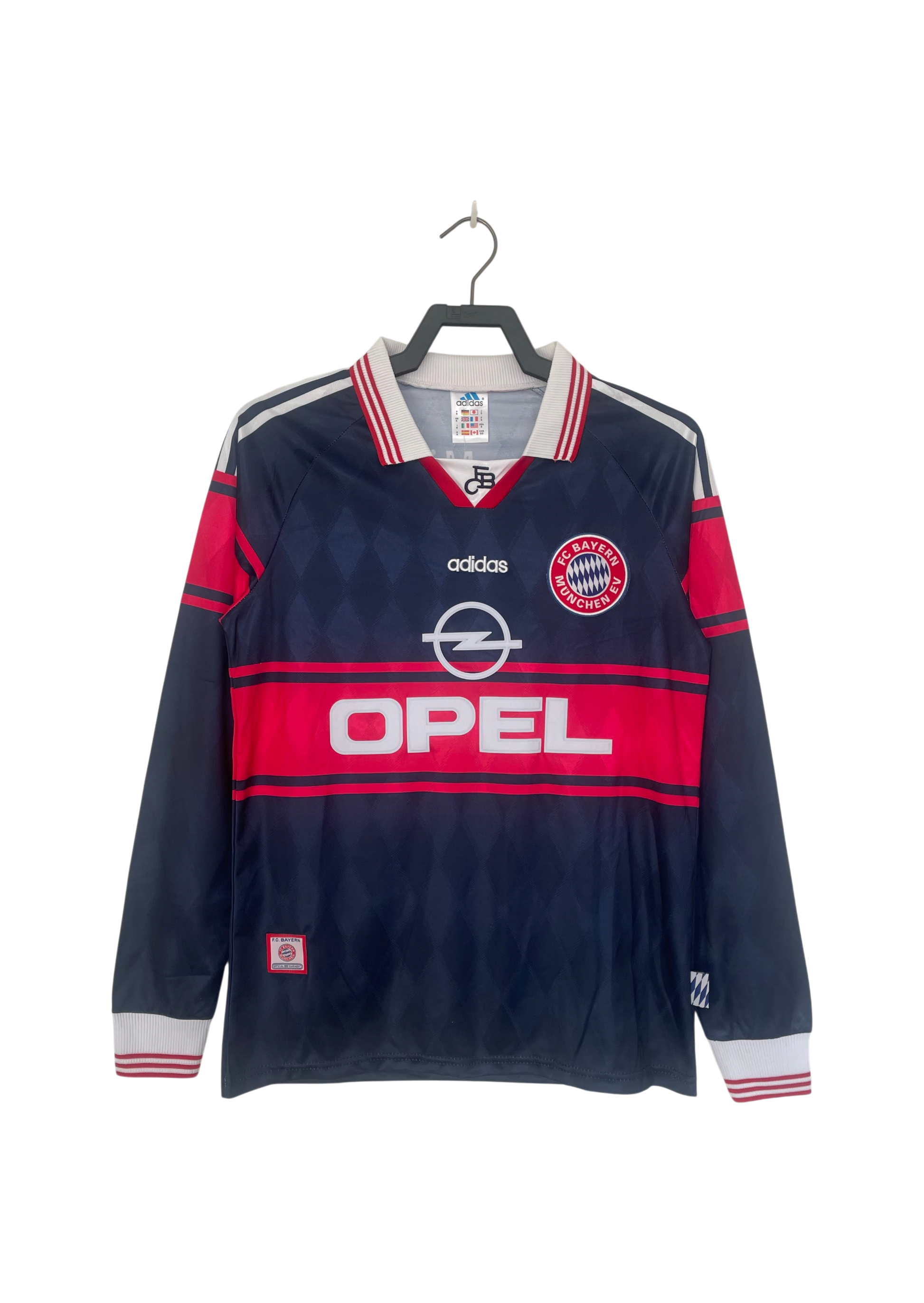 Navy and red sports jersey with Opel and Adidas logos on a hanger against a white background