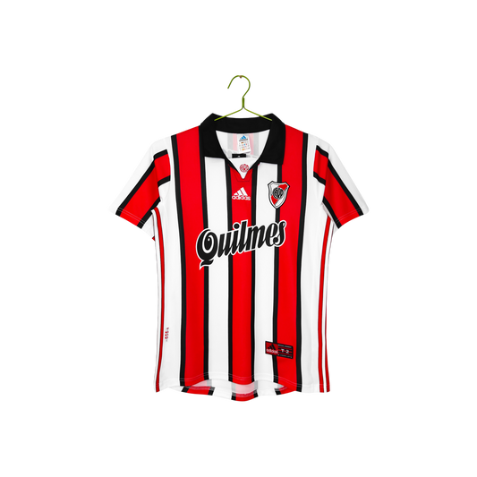 A vintage Adidas River Plate soccer jersey with red, black, and white vertical stripes, featuring the 'Quilmes' sponsor logo across the chest and an Adidas logo on the center of the neck, hanging on a green hanger against a white background.