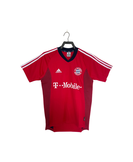 Red sports jersey with Adidas and T-Mobile logos on a hanger against a white background