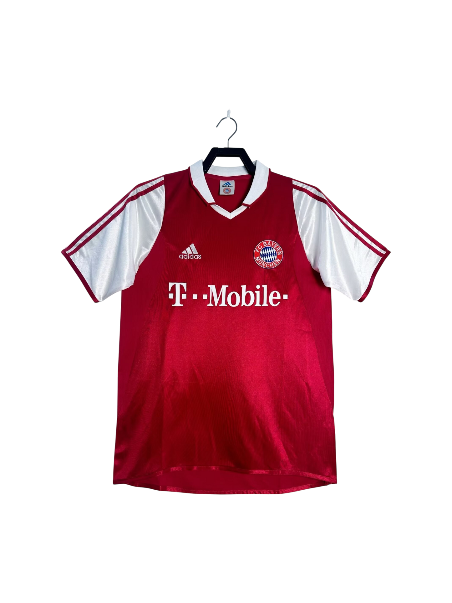 Red sports jersey with white sleeves on a hanger against a white background