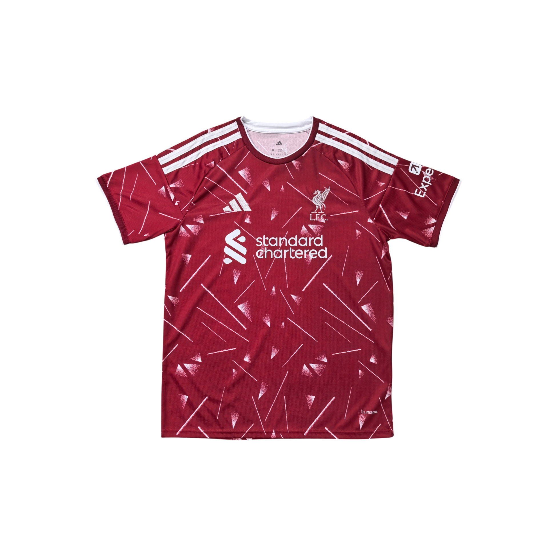 A red short-sleeve soccer jersey with white geometric line patterns, featuring the Liverpool club crest, the 'standard chartered' sponsor logo, and white stripes on the shoulders, displayed against a solid white background.