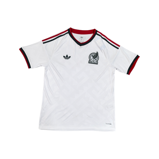 White t-shirt with red and black accents and Adidas logo on a white background