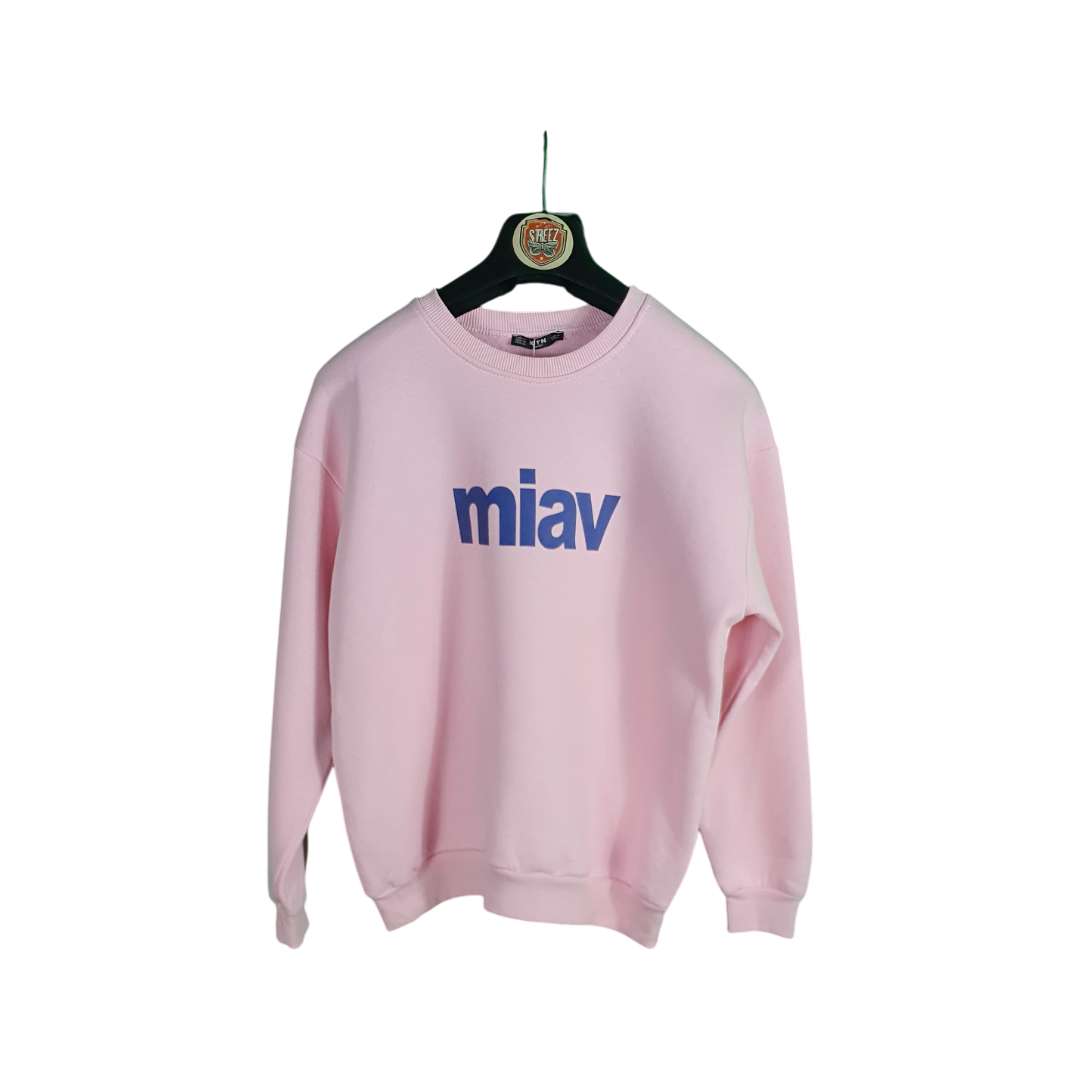 Pink sweatshirt with 'miav' logo on a hanger against a white background