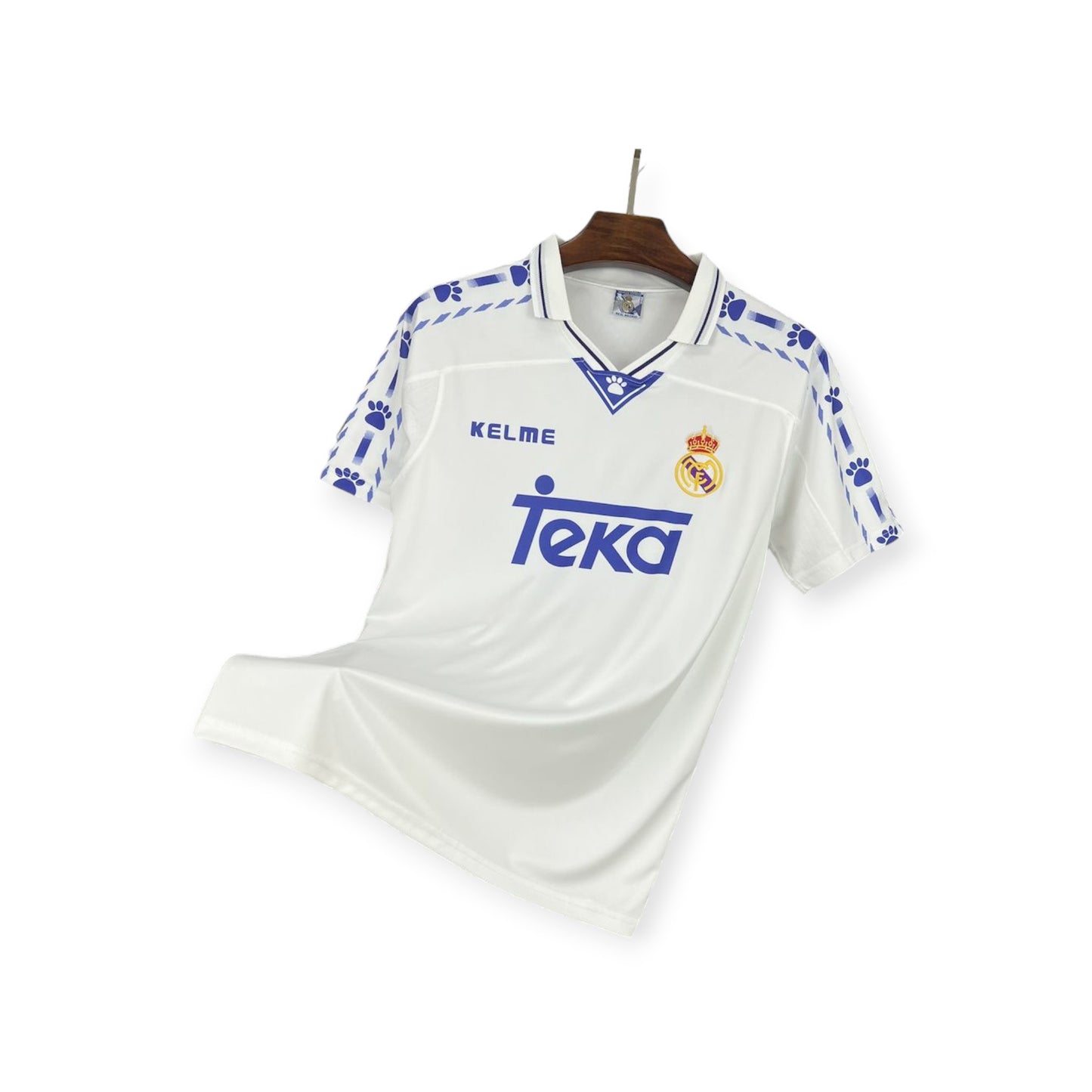 Real Madrid 1996/1997 Home Jersey displayed on a mannequin, predominantly white with blue accents and sponsor logo.